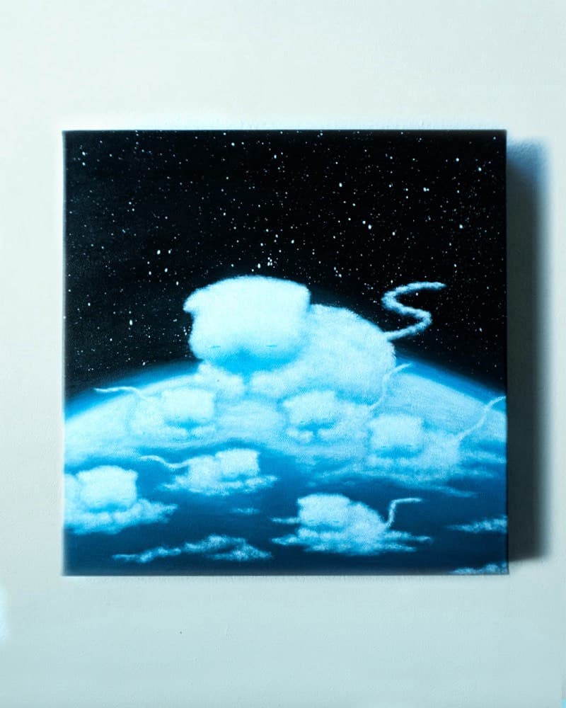 Several cloud-shaped cats drifting above a curved blue Earth, set against a starfield